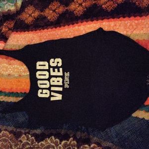 Medium-size,Black,and whit Pink body suit,worn a couple of times good condition.